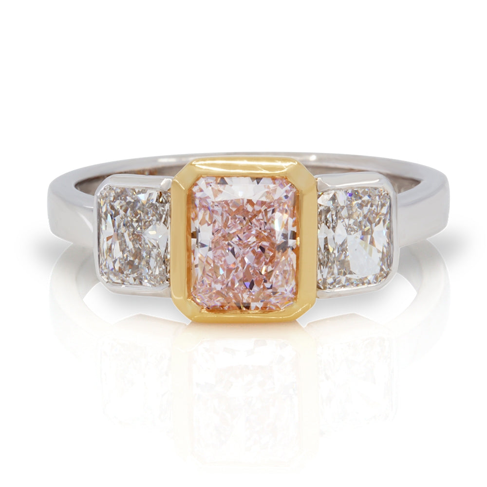 Platinum and 18K Rose Gold 3 Stone Ring with a Fancy Pink Center Diamond