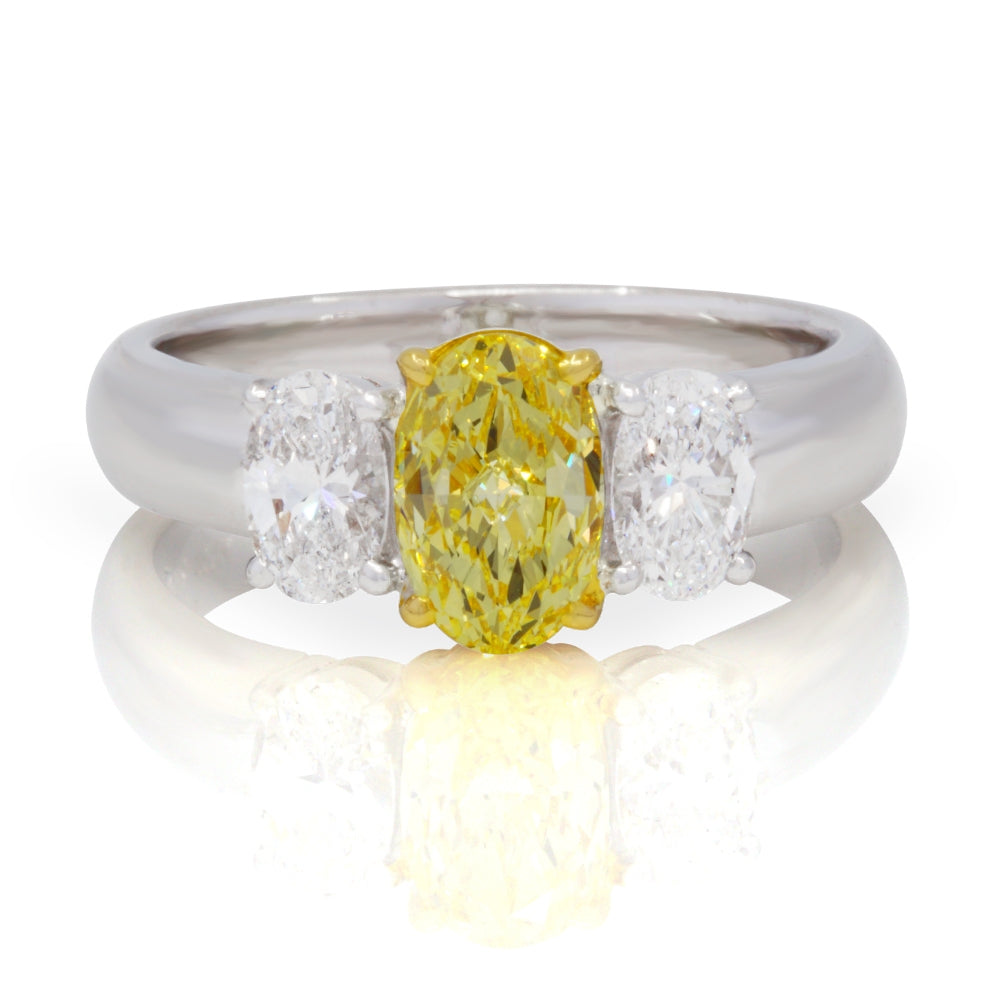 Platinum and 18K Yellow Gold 1.01 Fancy Intense Yellow Oval Diamond 3 Stone Ring